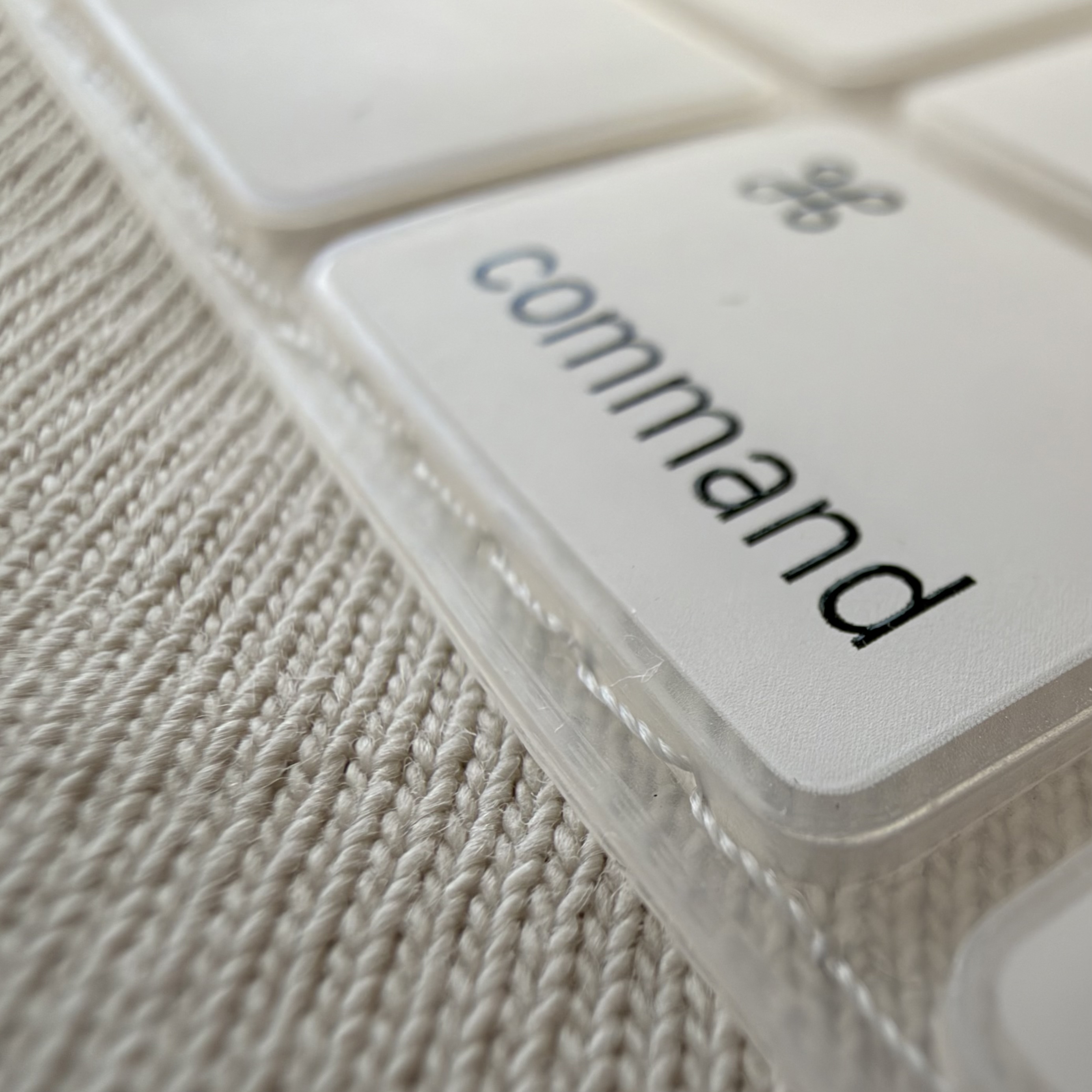 Close-up of a Yanabana garment label beside a textured white textile
