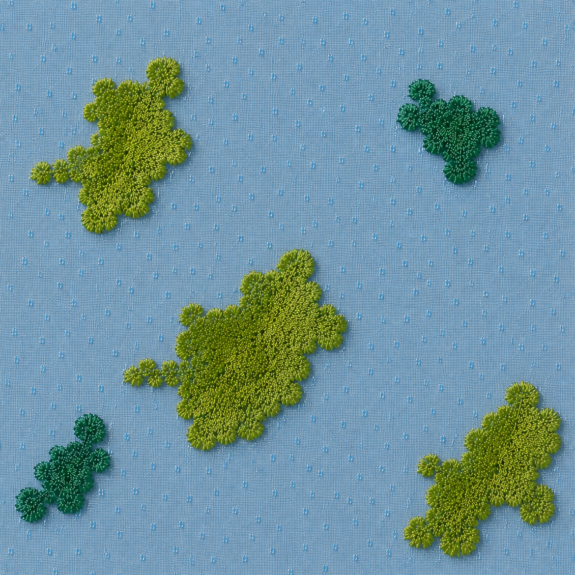 Blue textile with raised green embroidery patches