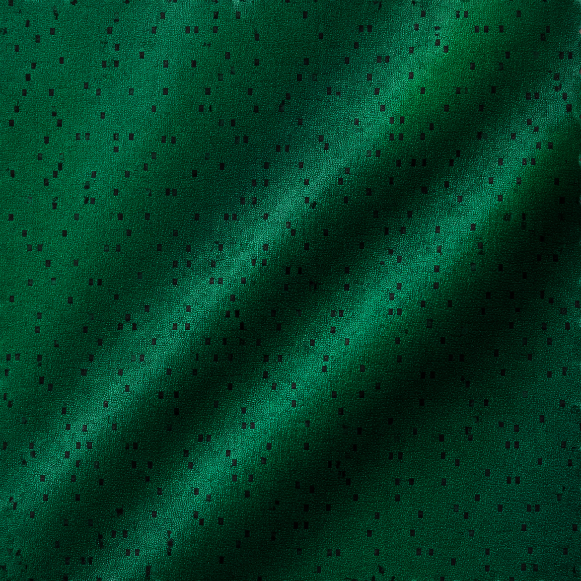 Green textile with dark encoded punch-card pattern